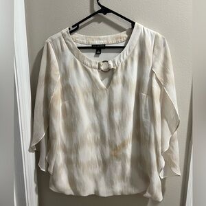 White blouse with gold detailing